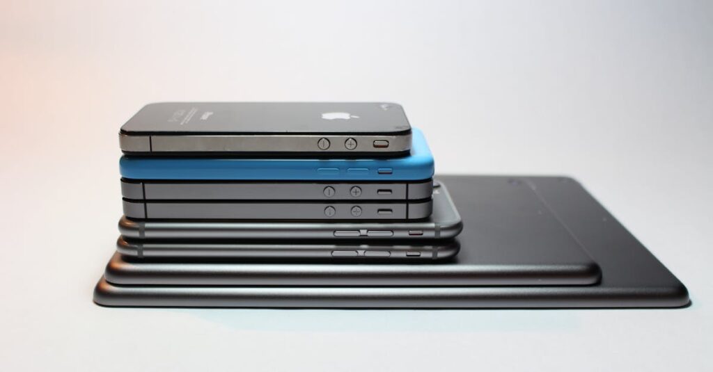pexels-photo-341523-341523 Stacked modern smartphones and tablets showcasing sleek design. Perfect tech background.